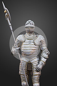 The uniform of a medieval knight with an ax, beautiful armor, decor for the interior