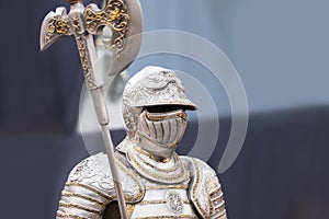 The uniform of a medieval knight with an ax, beautiful armor, decor for the interior