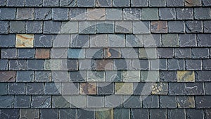 The uniform overlapping arrangement typical in slate roofing