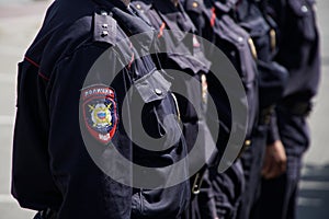 The uniform of the patrol of the Russian police. Emblem and epaulettes. Daylight