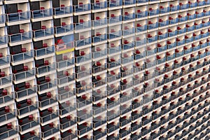 Uniformed looking apartments in a huge and overcrowded apartment building with one customized different