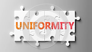Uniformity complex like a puzzle - pictured as word Uniformity on a puzzle pieces to show that Uniformity can be difficult and