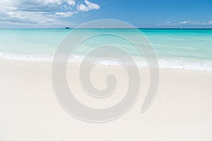 Uninhabited island. Sand pearlescent white claim as fine as powder. Clouds blue sky over calm sea beach tropical island