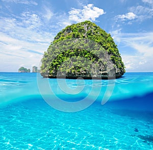 Uninhabited island with white sand bottom underwater view