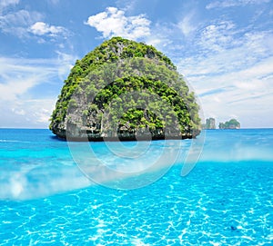 Uninhabited island with white sand bottom underwater view