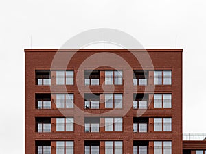 Uninspired building Facade with Red Clinker Stones photo