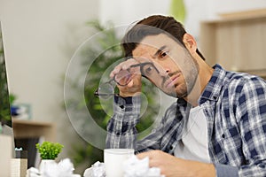 Uninspired man struggling to write letter photo