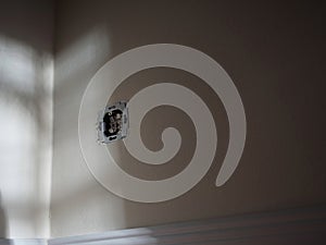 Uninstalled Wall Socket with Exposed Wiring