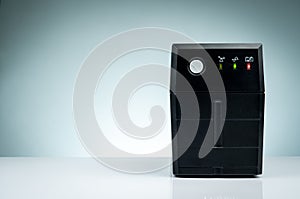 Uninterruptible power supply. Backup Power UPS with battery isolated on table. UPS for PC. Equipment for computer system