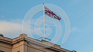 Union flag flying against a blue sky (Union Jack)