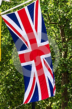 Union Jack Flag flying from a flag pole on The Mall street. London. England