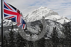 Union Jack flag in front of Mountain scenery