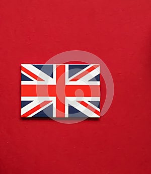 Union Jack flag of Great Britain  on red background, Queen's Platinum Jubilee and holiday celebration