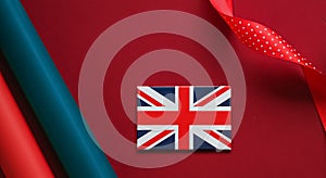 Union Jack flag of Great Britain  on red background, Queen's Platinum Jubilee and holiday celebration