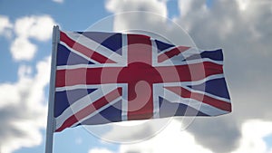 Union Jack flag of the United Kingdom proudly fluttering in the wind