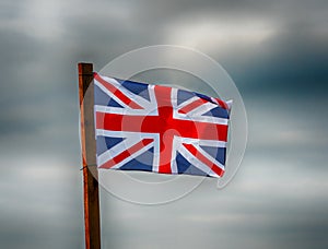 Union Jack with gathering storms clouds behind