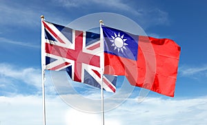 Union Jack and Taiwan flag on cloudy sky. waving in the sky