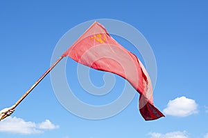 The Union of Soviet Socialist Republics flag waving on blue background