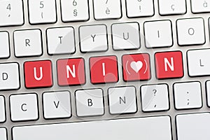 UNION writing on white keyboard with a heart sketch with parenthesis