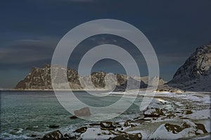 The unique and beautiful beach at Utakleiv dressed in winter colors