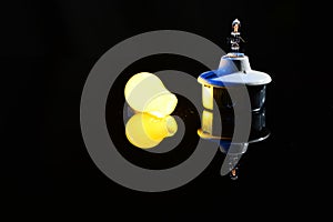 Broken Light Bulb with Power Isolated on Black