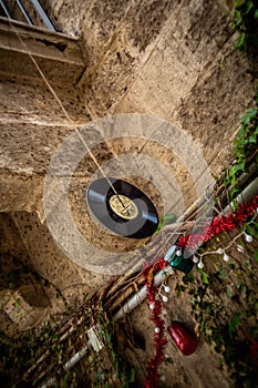 Unique Christmas Decoration: Vinyl record Hanging from Christmas Branch in a Typical Polignano a Mare Street photo