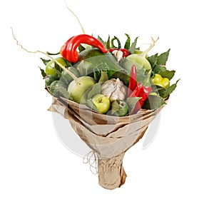 Unique colorful bouquet of vegetables and fruits as a gift on a white background
