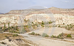 Unique colorful sandstone rock formations in the Rose Valley. Cappadocia, Turkey