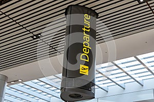 Unique departure sign inside of an international airport
