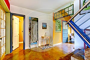 Unique entryway to home with very colorful interior.