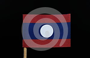 A unique flag of Laos on toothpick on black background. A horizontal triband of red, blue and red. Charged with a white circle in