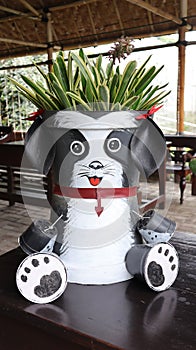 Unique flower pot are made from several small and large plastic flower pots painted and modified to form animals