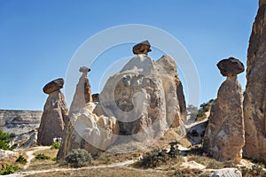 Unique geological rock formations Fairy Chimneys in Cappadocia. Popular touristic area in Turkey