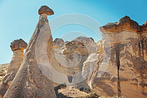 Unique geological rock formations Fairy Chimneys in Cappadocia. Popular touristic area in Turkey