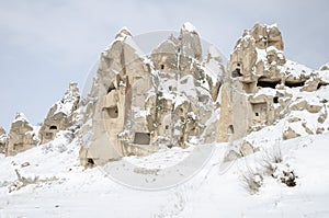 Unique geological rock formations under snow in Cappadocia, Turkey