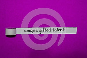 Unique Gifted Talent, Inspiration, Motivation and business concept on purple torn paper