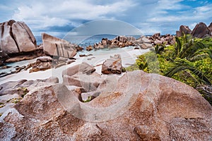 Unique granite rocks and cute remote and hidden Anse Marron beach in La Digue island, Seycheles islands