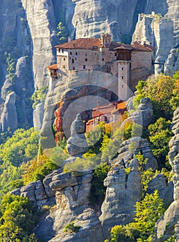 Unique Meteora monasteries. Zoom view on the Holy Roussanou Monastery placed on the edge of high rock. The Meteora area is on