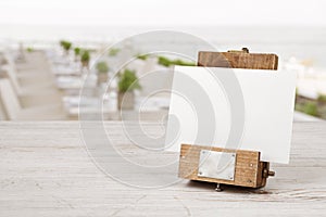 Unique mockup menu frame on table over blurred restaurant interior