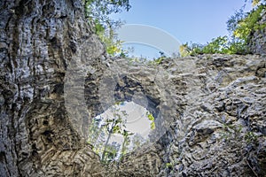 Unique rock formation of a hole on a rock cliff at Rakov Skocjan in Slovenia