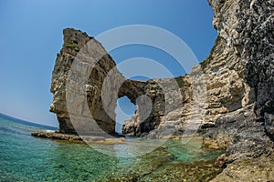 Unique and scenic arch in the cliffs, Paxi, Greece