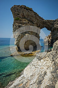 Unique and scenic arch in the cliffs, Paxi, Greece