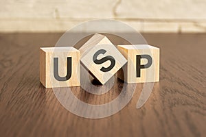 unique selling proposition concept with symbols USP on wooden blocs