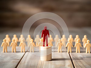 Unique toy figure in front of others. Concept of business leadership for team