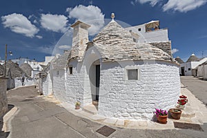 Unique Trulli houses, traditional Apulian dry stone hut with a conical roof in Alberobello, Puglia, Italy