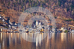 Unique view of famous Hallstatt mountain village in the Austrian Alps. Beautiful view on the other side of the shore