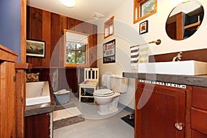 Unique vintage style bathroom with tile floor.