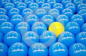 Unique yellow ball among blue balls