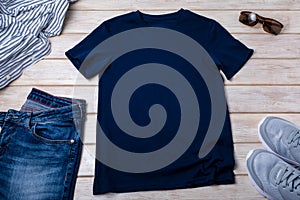 Unisex navy blue T-shirt mockup with trainers and jeans