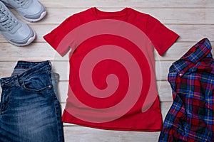 Unisex red T-shirt mockup with trainers and jeans